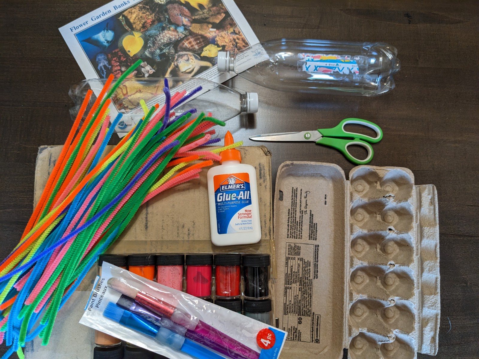 Supplies for creating an upcycled coral reef laid out on a table (supply list in text).