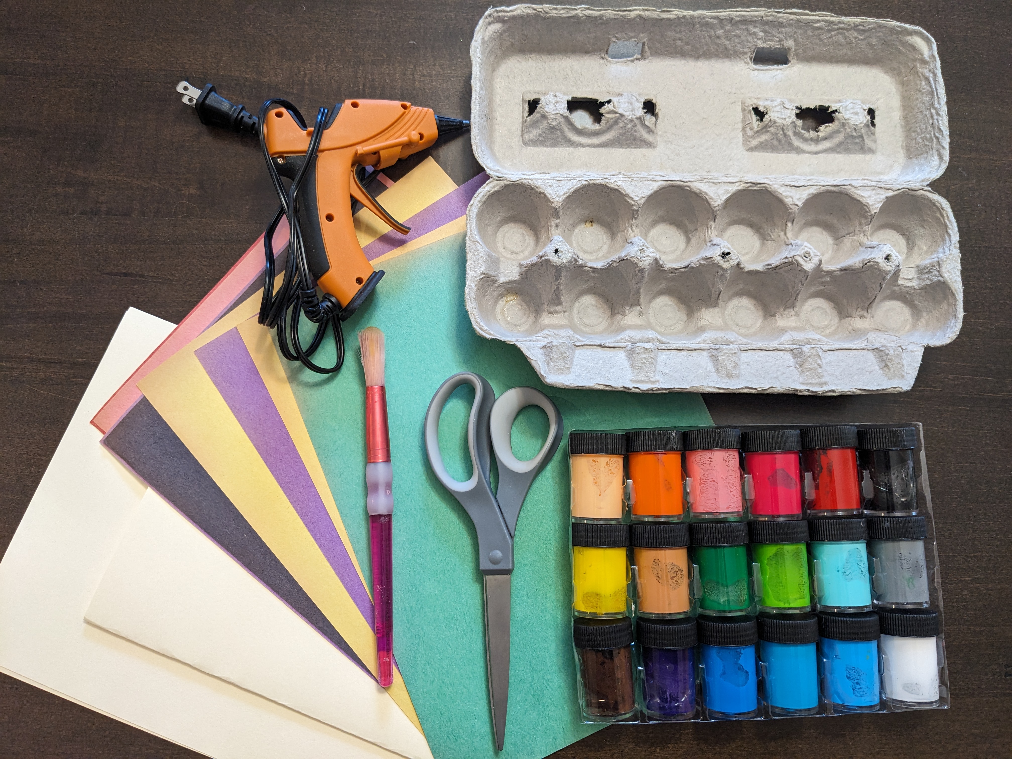 A pile of supplies needed for making greeting cards.