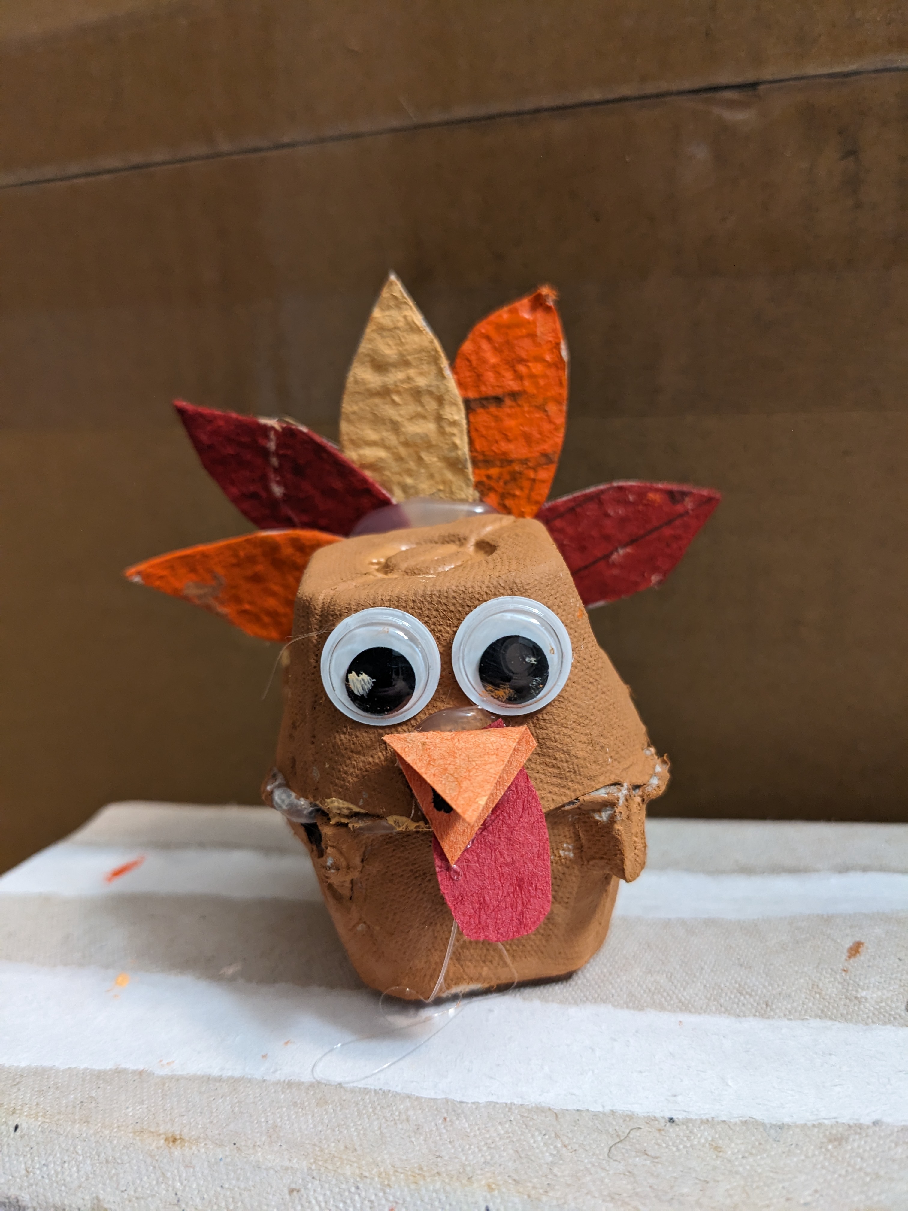 The finished craft - a turkey made of repurposed egg cartons.