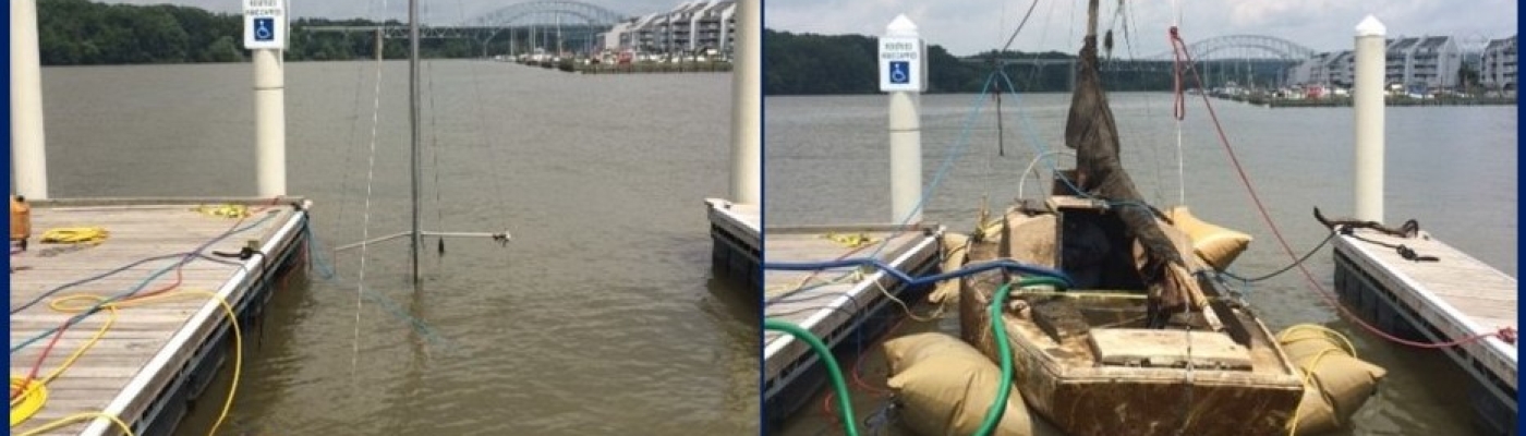 Sunken sailboat raised in a Maryland marina.