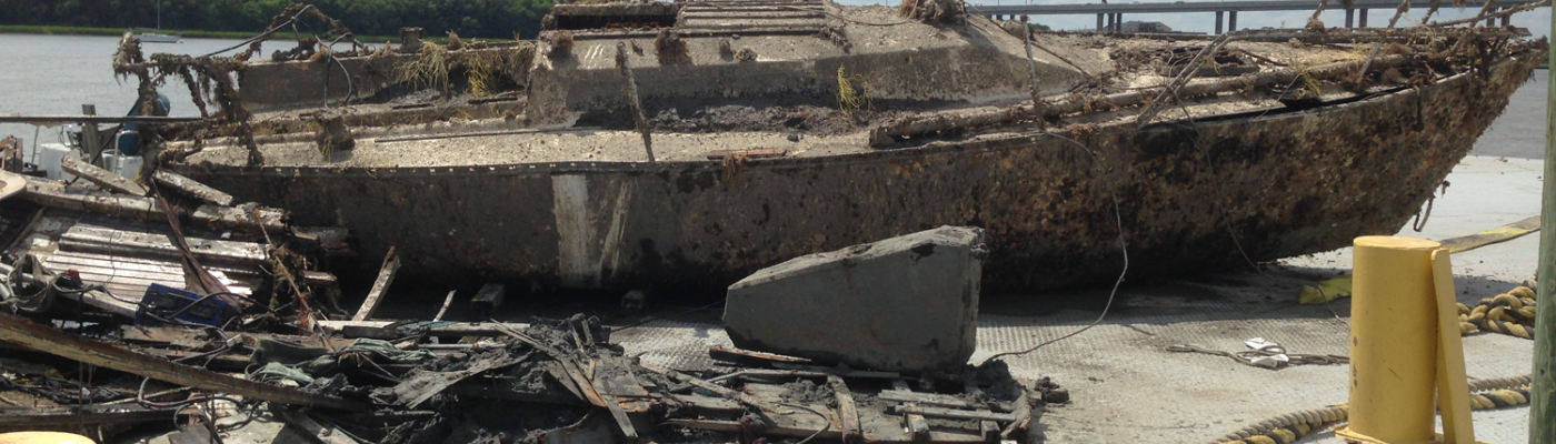 Derelict boat hauled out for disposal.