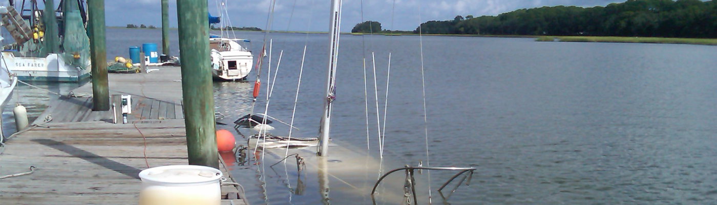 Abandoned sailboat sunk at moorage.