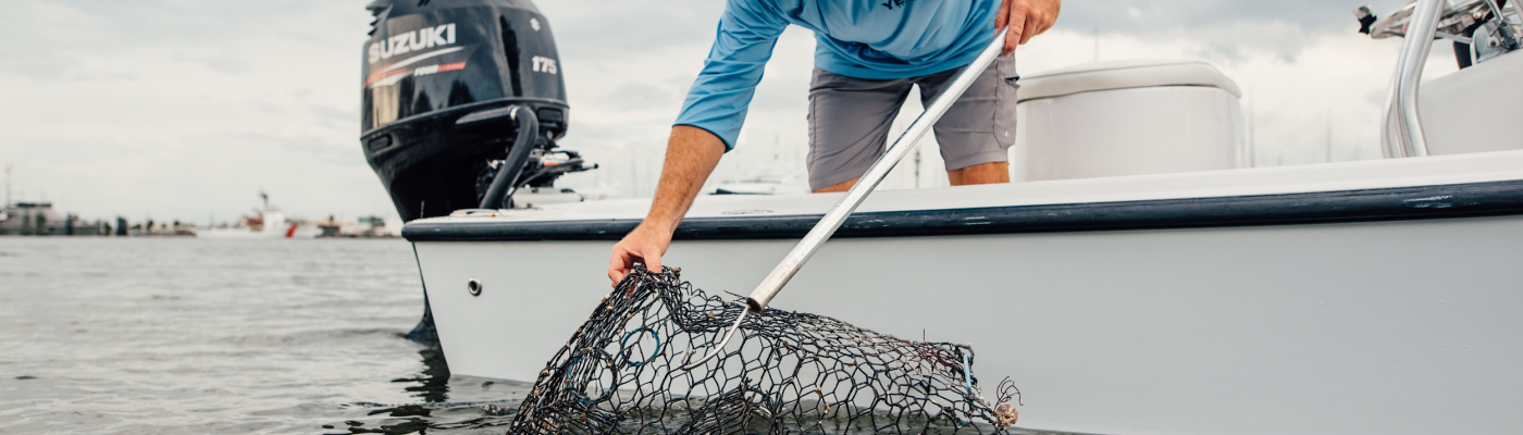 Man on a boat with a crab trap.