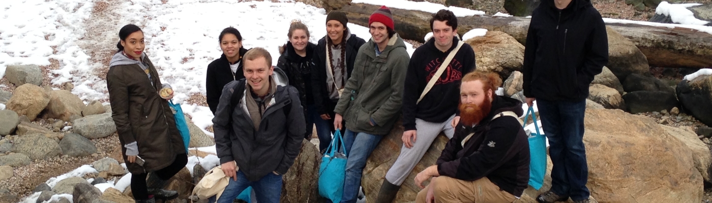 A group of students on a beach.