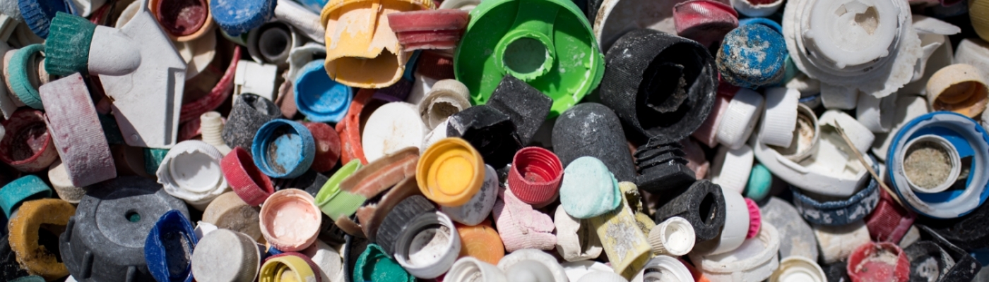 Assorted bottle caps recovered from a beach cleanup.