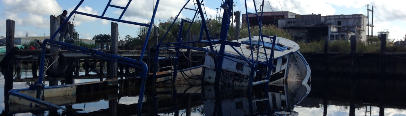 A partially-submerged abandoned and derelict vessel.