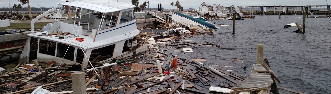 Marine debris piled high along a shore.