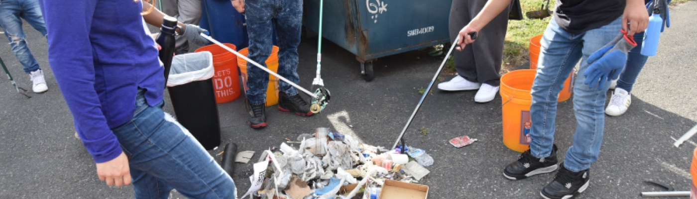 Students collect and sort trash.