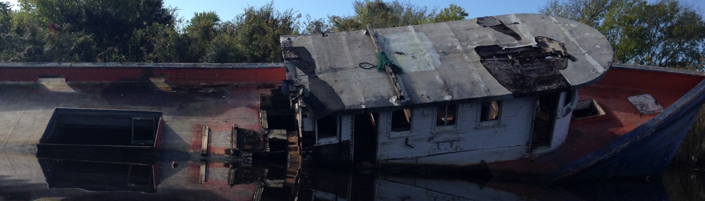 An Abandoned and Derelict Vessel in a Waterway.