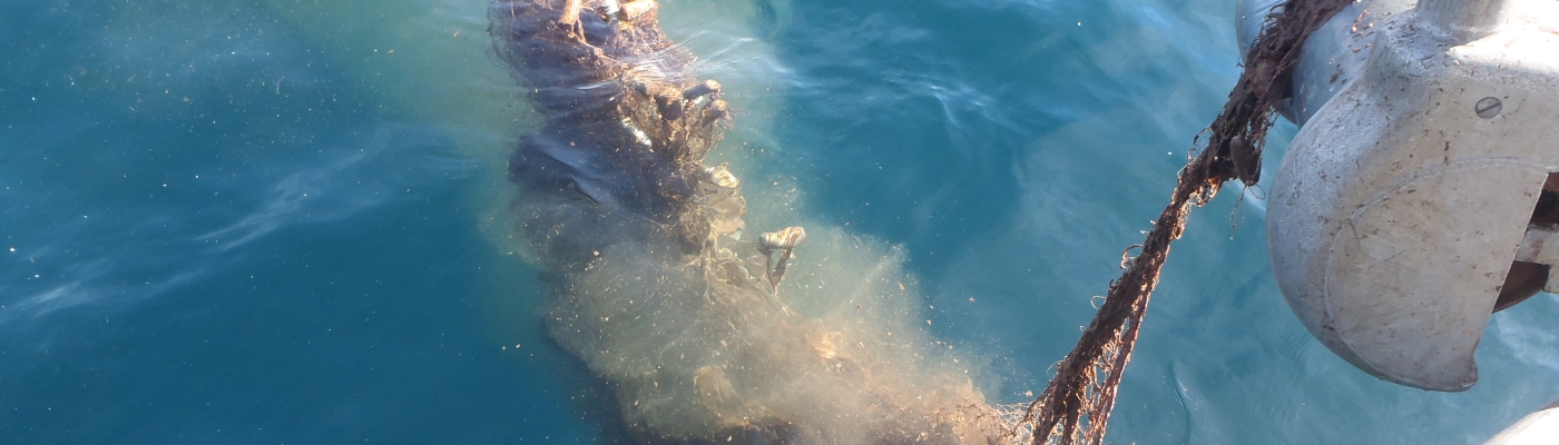 A ghost net is pulled onto a boat in Lake Superior. 