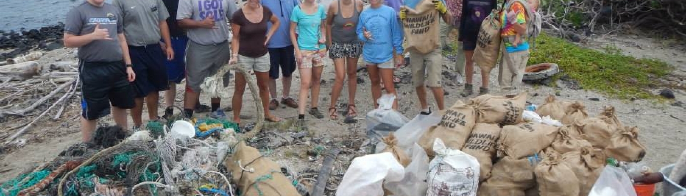 HWF volunteers removing debris from Kamilo. 