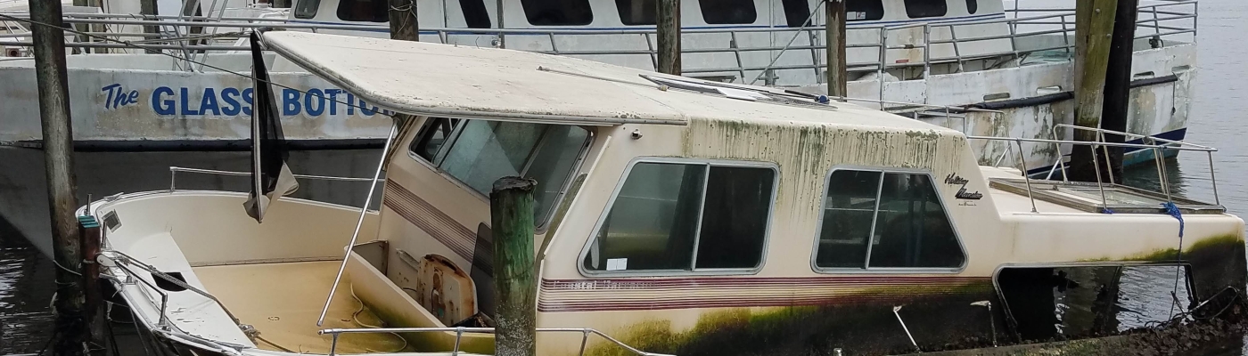 A derelict vessel in an inlet.