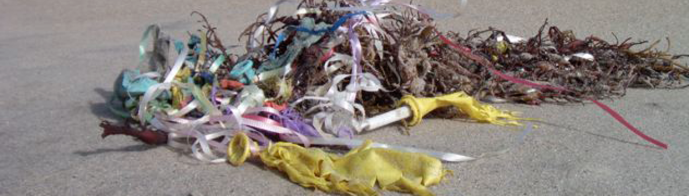 Deflated balloons on a beach.