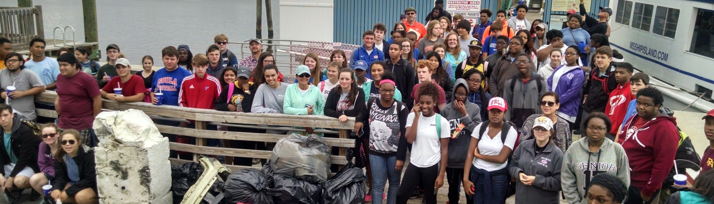 A group of students on a pier.