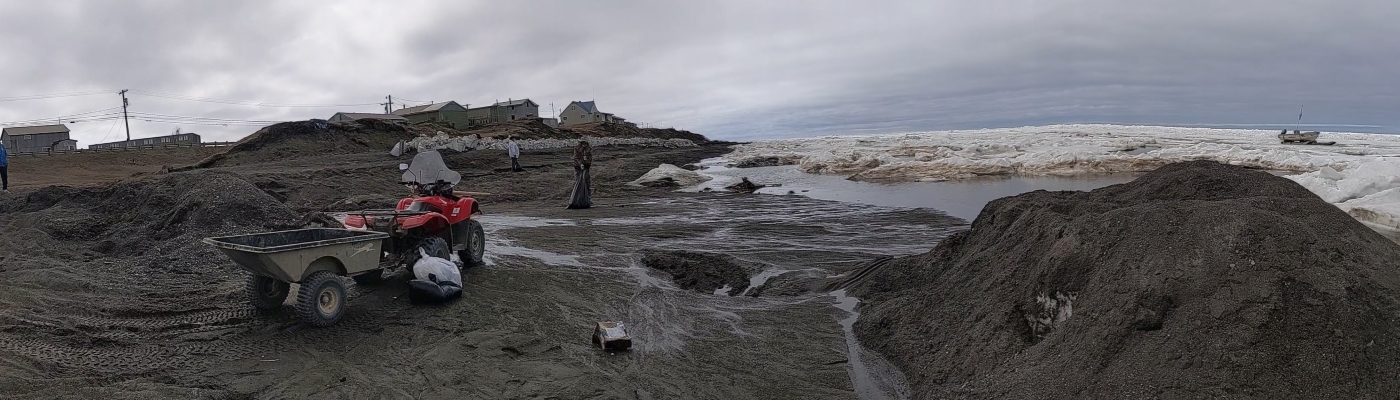 Wildlife staff removing marine debris along the shore of the North Slope Borough of Alaska.