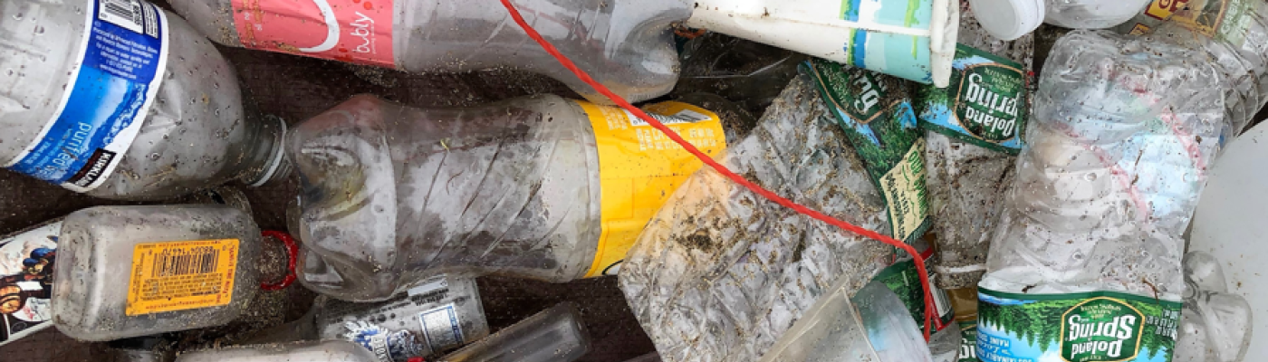 A pile of different single-use plastic bottles. 