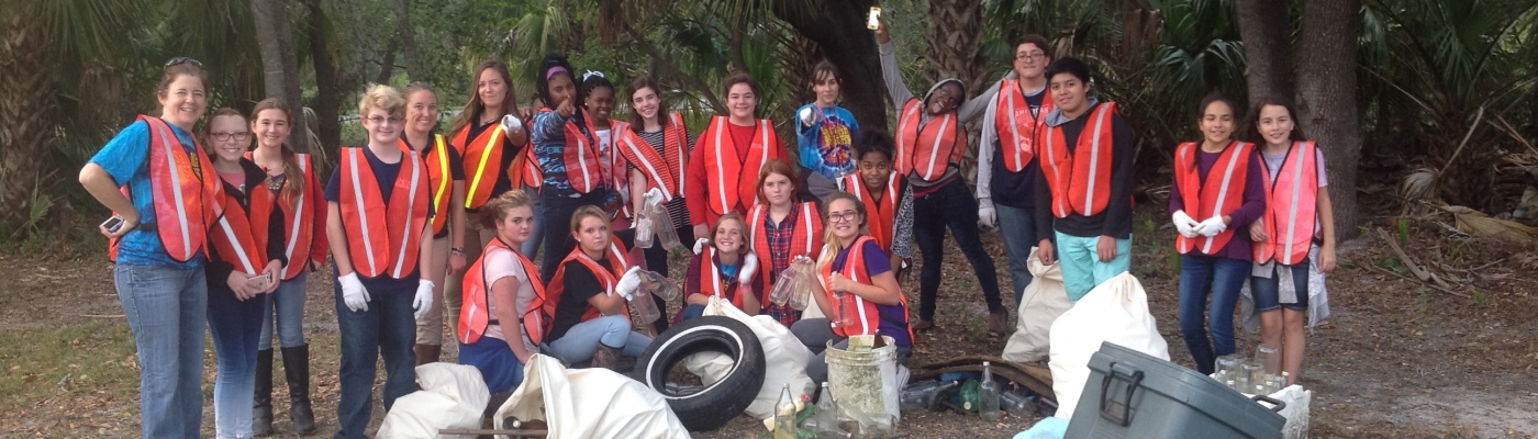 A group of students with trash they collected.