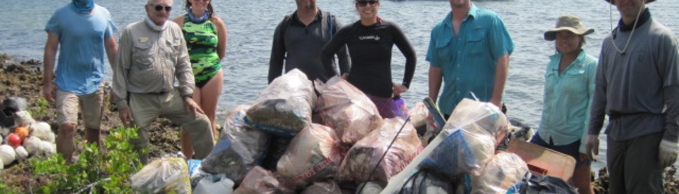 Volunteers with the Coastal Cleanup Corporation show marine debris collected from a barrier island within Biscayne National Park.