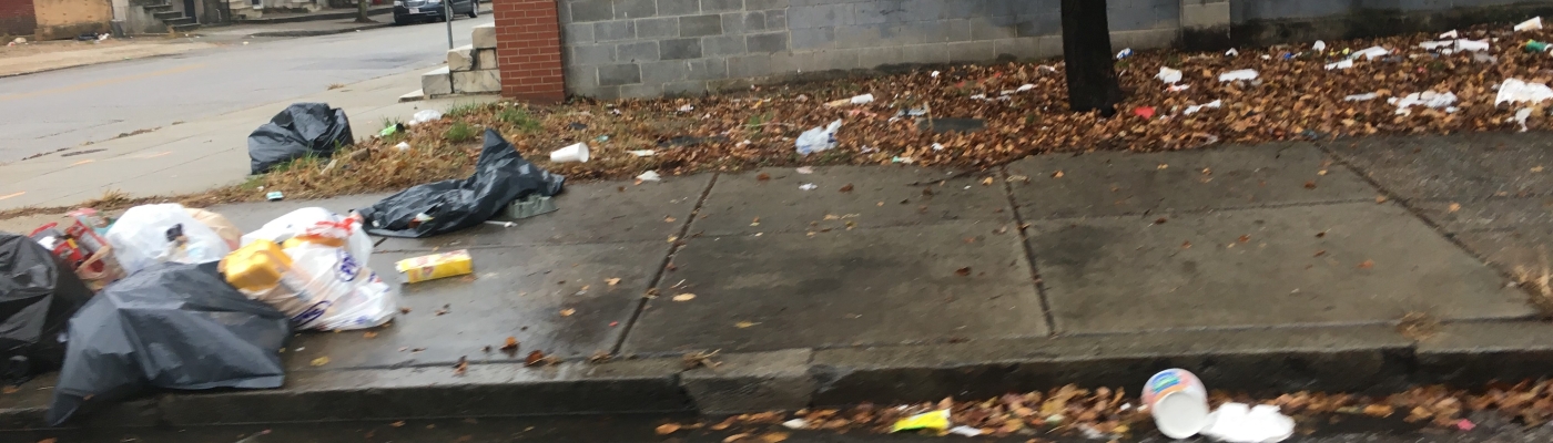 Trash on the sidewalk.