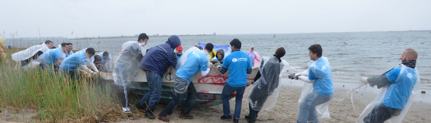 Volunteers remove a derelict vessel. 