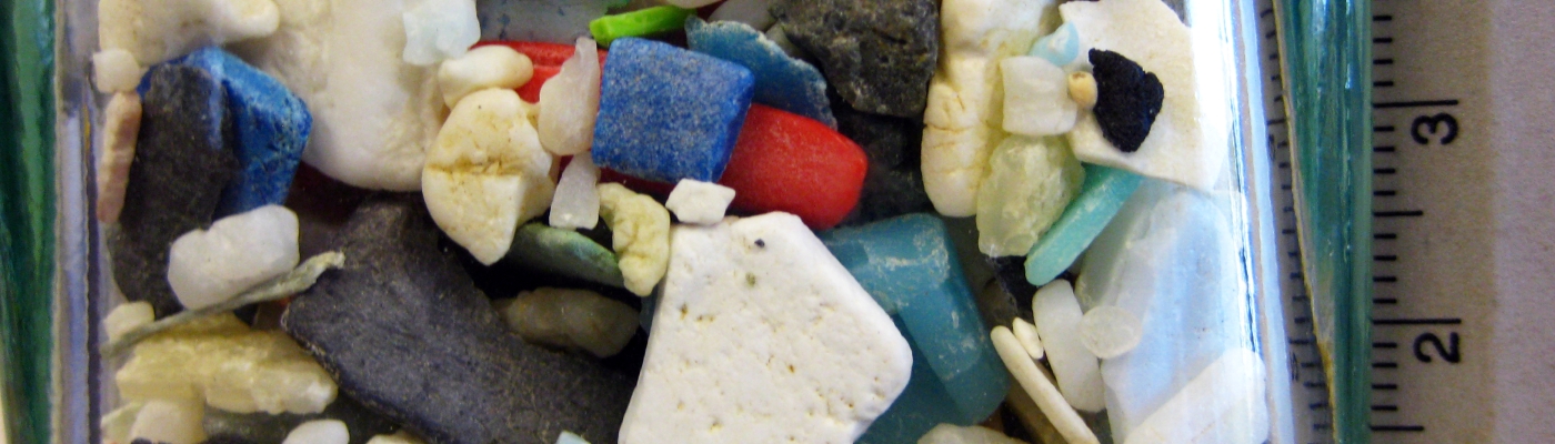 Colorful microplastics in a bottle.