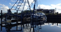 A partially-submerged abandoned and derelict vessel.