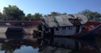 An Abandoned and Derelict Vessel in a Waterway.