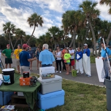 Man standing in front of a crowd. 