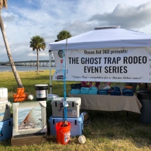 Exhibitor tent and fishing supplies. 
