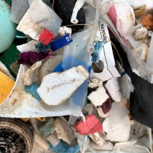 A close up view of microplastics in a pile on a table.