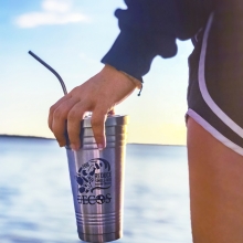 An Eckerd College student with a reusable tumbler.