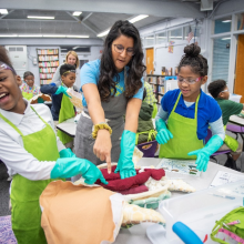 Instructor Kiran Sinha points out organs and a student begins to gag.