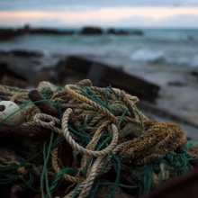 A derelict fishing net washed up on the rocky shores of Sand Island, Midway Atoll. 