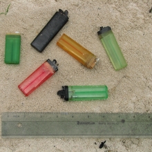 Disposable cigarette lighters found on a beach.