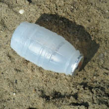 Plastic juice bottle found a beach at North Point State Park, MD. Note that the lid is made of metal, however, the external material type is predominantly plastic, so the item is categorized as 'Plastic Beverage Bottle.'