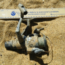 Plastic fishing reel found along the shore of the Chesapeake Bay.