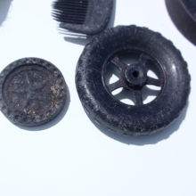 Plastic toys (wheel and checker) found on Kamilo Beach, Big Island (Hawaii), HI.