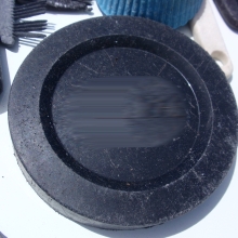 Plastic camera lens cap found on Kamilo Beach, Big Island (Hawaii), HI.