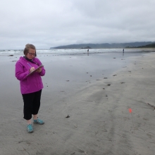 NOAA MDP's Research Coordinator counting debris on a beach.