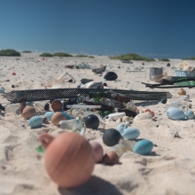 Marine debris strewn along the shore of Pearl and Hermes Atoll 