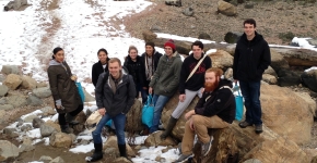 A group of students on a beach.