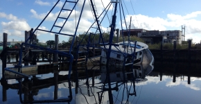 A partially-submerged abandoned and derelict vessel.