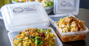 Reusable takeout containers on a counter.