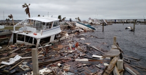 Marine debris piled high along a shore.