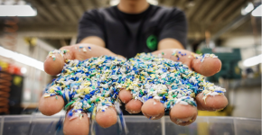 Small fragments of plastic in two outstretched hands.