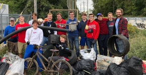 Volunteers posing with trash. 