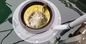 A Seabin cleanup device installed in a lake marina.