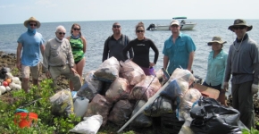 Volunteers with the Coastal Cleanup Corporation show marine debris collected from a barrier island within Biscayne National Park.