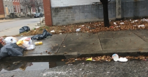 Trash on the sidewalk.