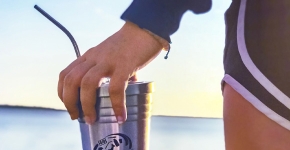 An Eckerd College student with a reusable tumbler.